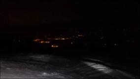 Winterabfahrt mit Fackeln bei Nacht